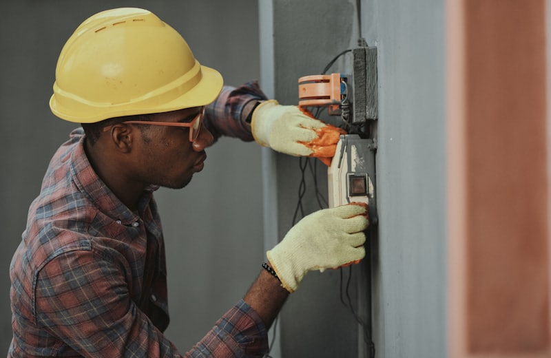 Electrician working on an electrical distribution panel