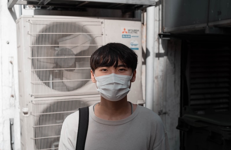 Technician servicing a wall-mounted split air conditioner