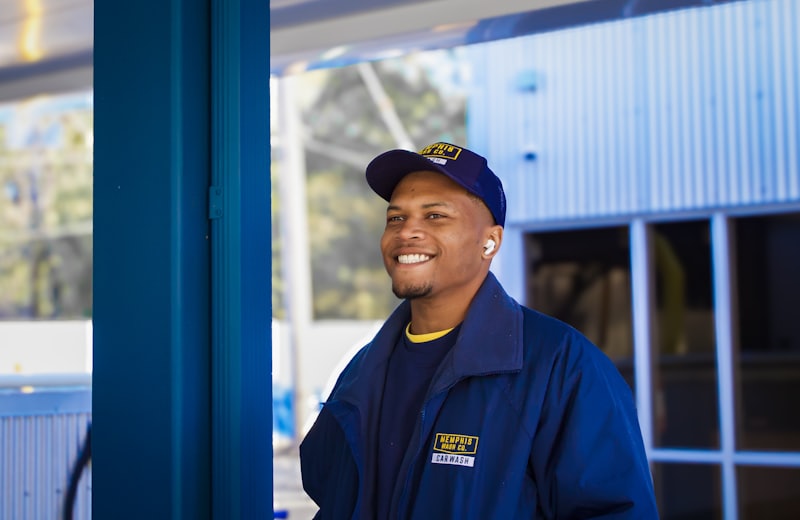 Maintenance technician in uniform outside a building